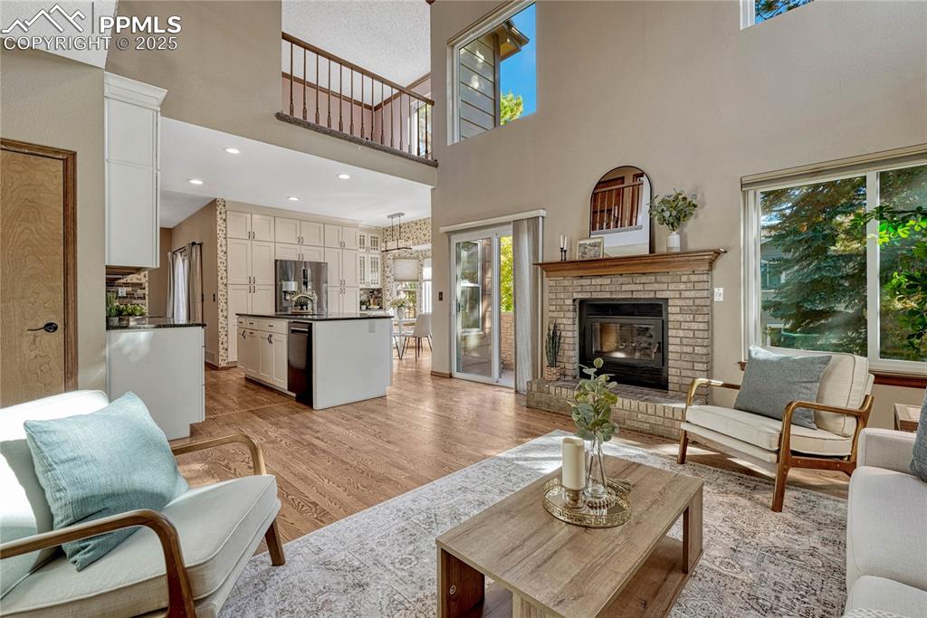 Image 8 of 48: Loft overlooks the family room. Wood burning fireplace is also plumbed for