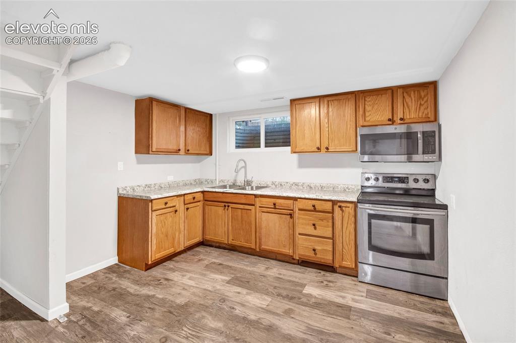 Image 21 of 31: second kitchen in basement