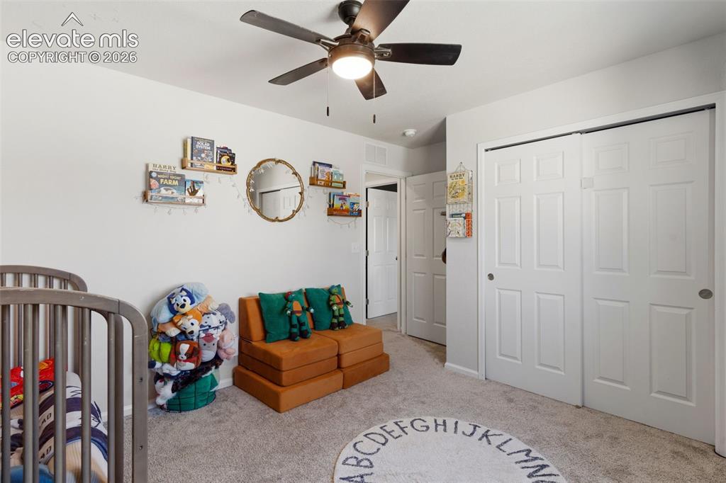 Image 28 of 33: Spacious room featuring light gray carpeting, neutral wall paint, a ceiling