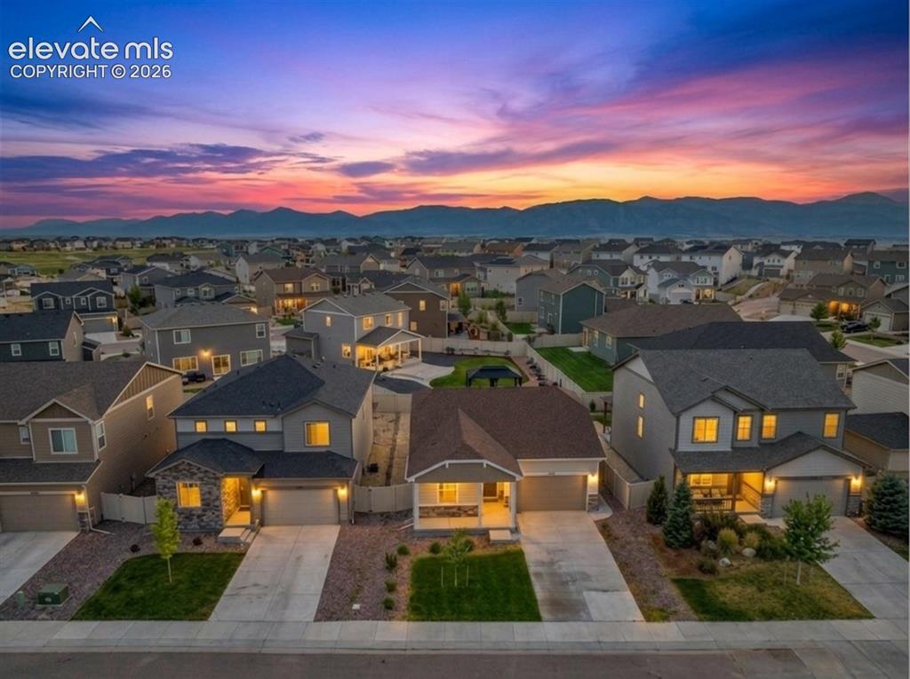 Image 3 of 33: Residential neighborhood with varied architectural styles, individual garag