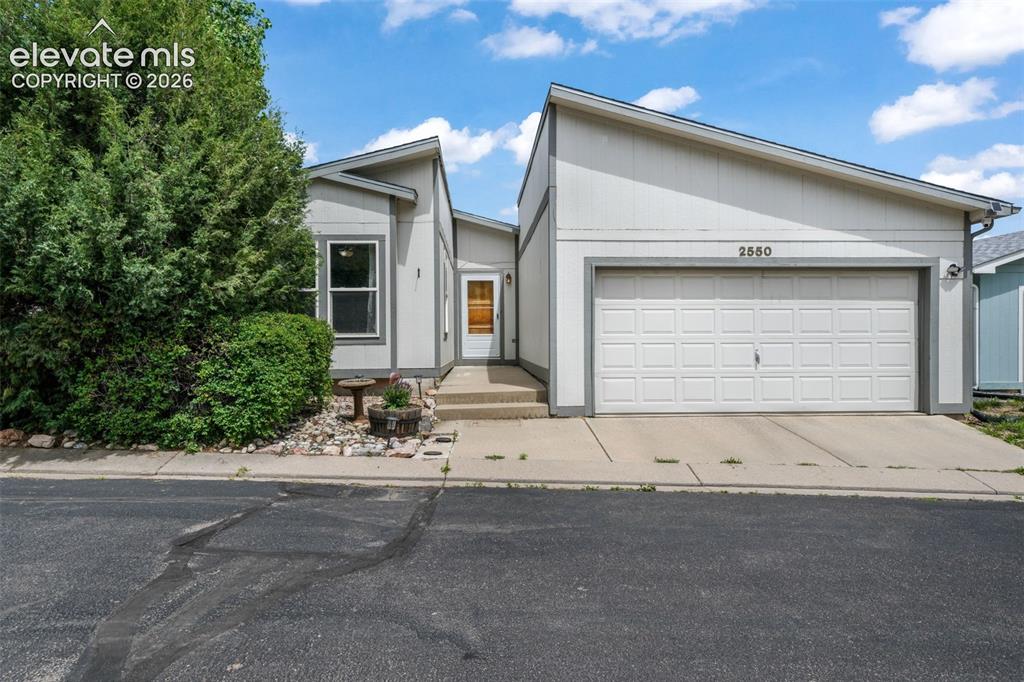 Caption: Contemporary exterior with a 2 car attached garage