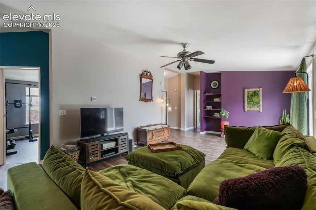 Image 10 of 50: Spacious living area featuring LVP