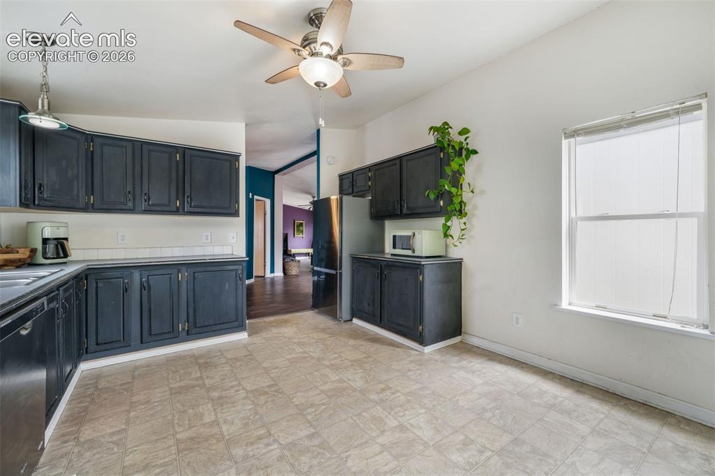 Image 13 of 50: Kitchen with stainless steel appliances