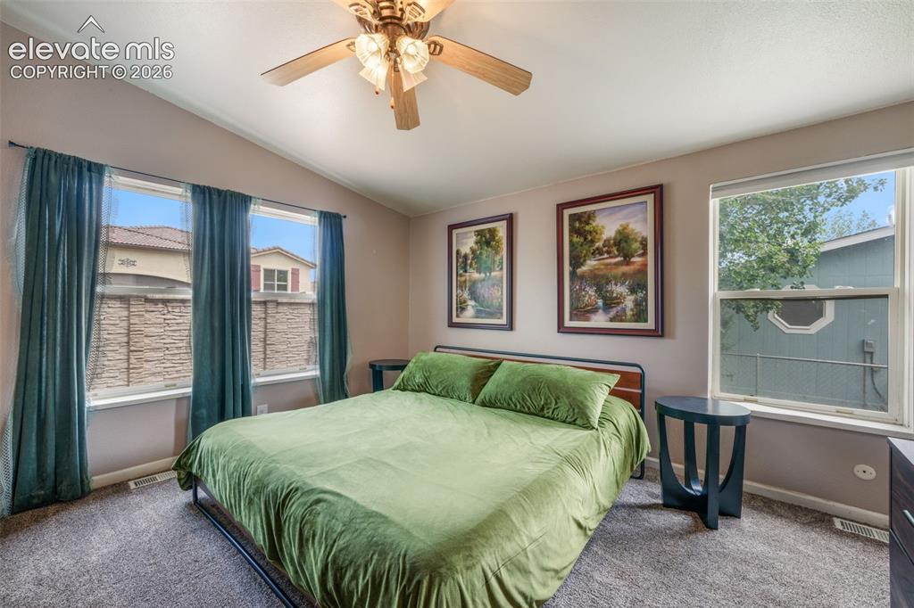 Image 19 of 50: Primary suite neutral-toned walls and plush grey carpeting