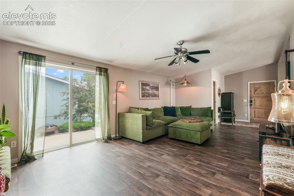 Image 6 of 50: Unique wood entry door, LVP and an open floor plan