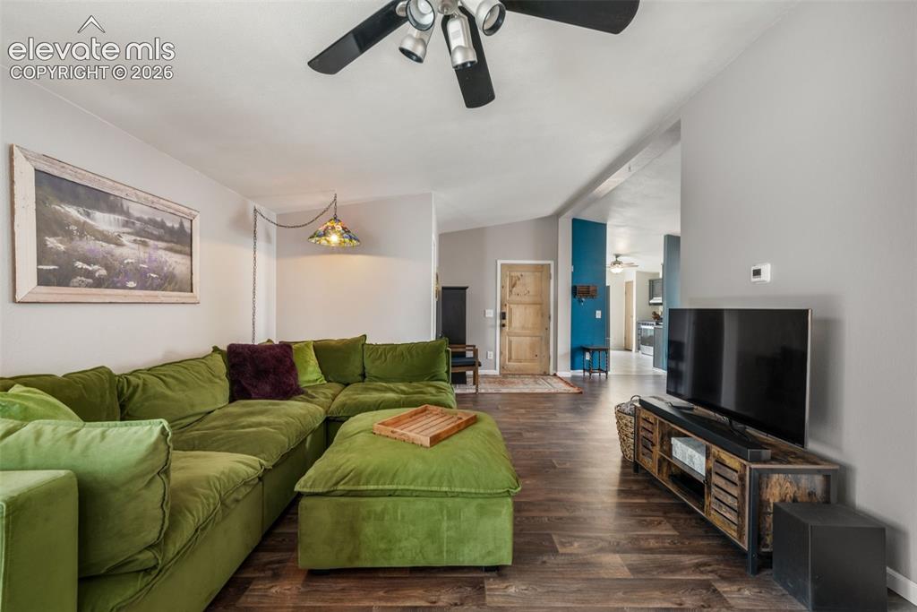 Image 7 of 50: Living room with LVP and backyard access