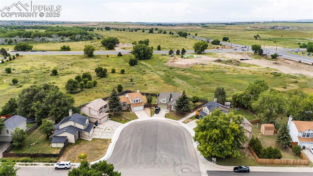 Image 8 of 33: Aerial view of sparsely populated area with nearby suburban area