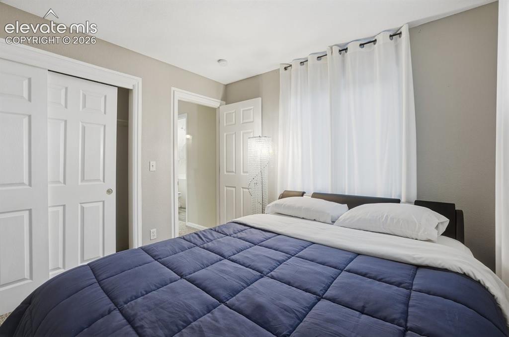 Image 16 of 45: Bedroom featuring light gray walls and white trim
