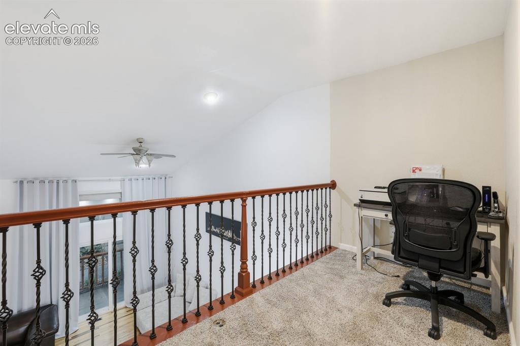 Image 25 of 45: Versatile loft overlooking the two-story living room featuring plush carpet