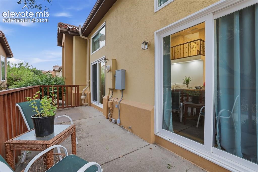 Image 37 of 45: Private patio with gated access to the community sidewalk, just steps from