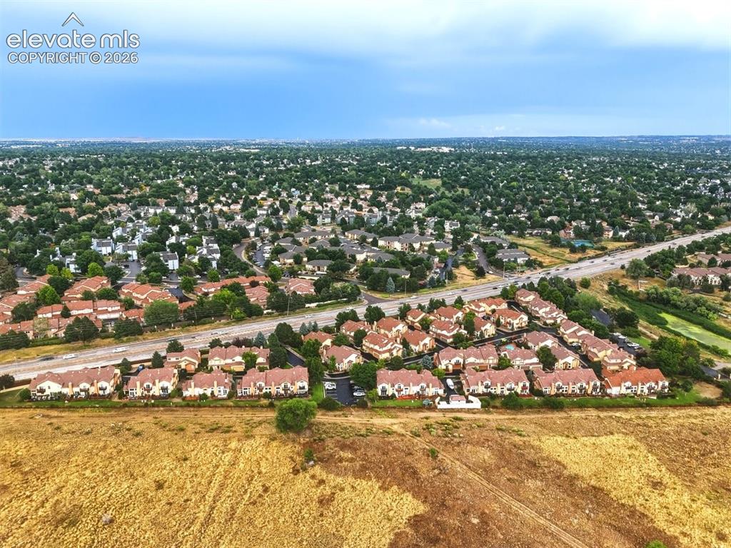 Image 45 of 45: Aerial view showcasing the established townhome community surrounded by mat