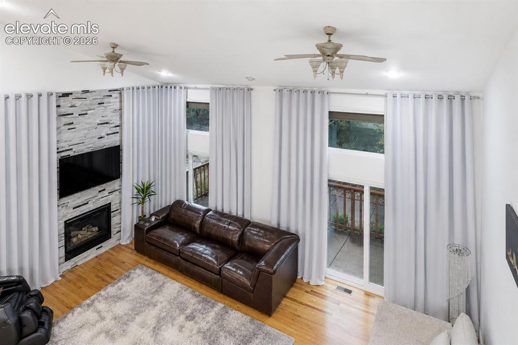 Image 5 of 45: An elevated view showcases the impressive two-story living room, featuring