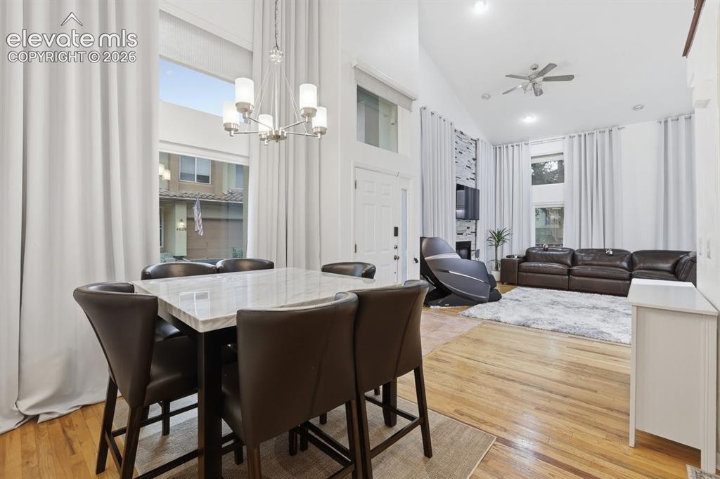 Image 8 of 45: Open-concept dining area seamlessly connected to the living room featuring