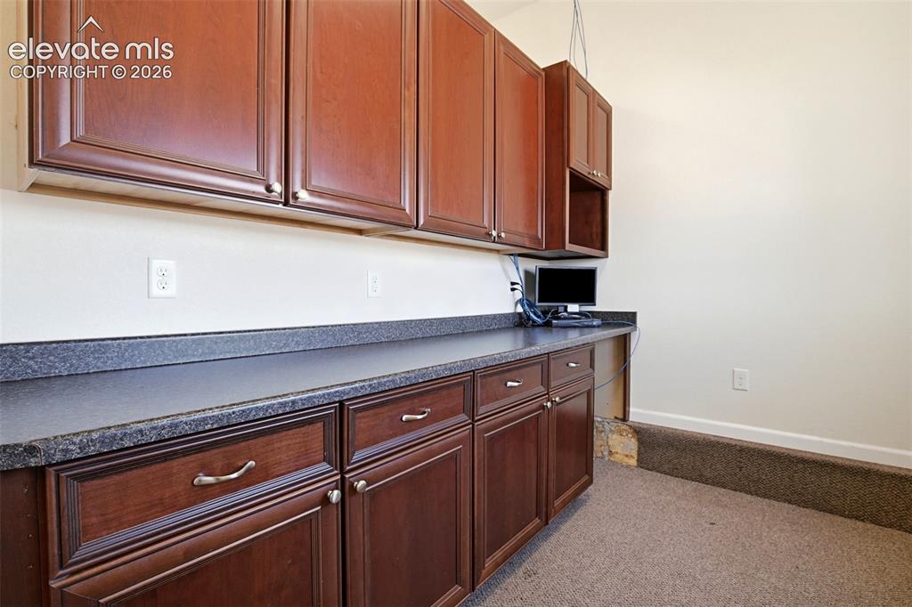 Image 20 of 41: Kitchenette in garage - great for extra storage!