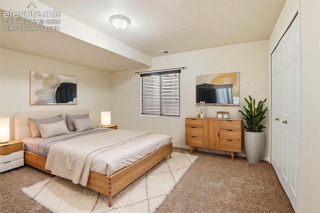 Image 26 of 41: Downstairs bedroom - Virtually Staged