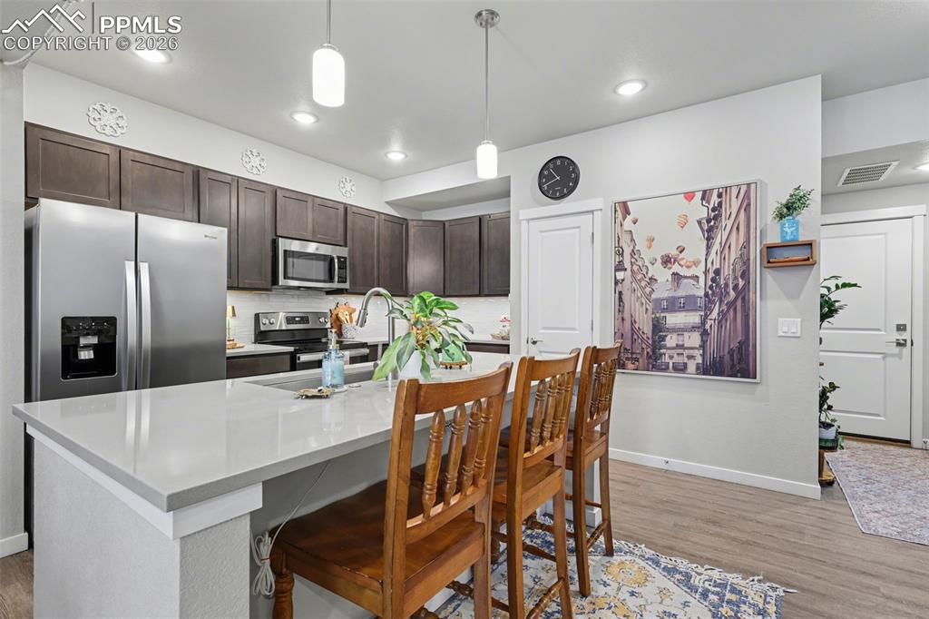 Image 10 of 35: Under cabinet lighting with warmth and function to the kitchen.
