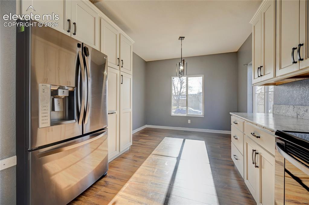 Image 5 of 40: Great Room: Livingroom + Dining 
