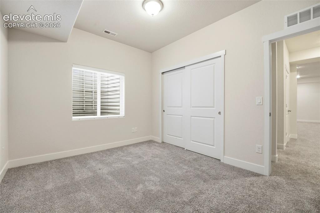 Image 27 of 37: Basement Bedroom