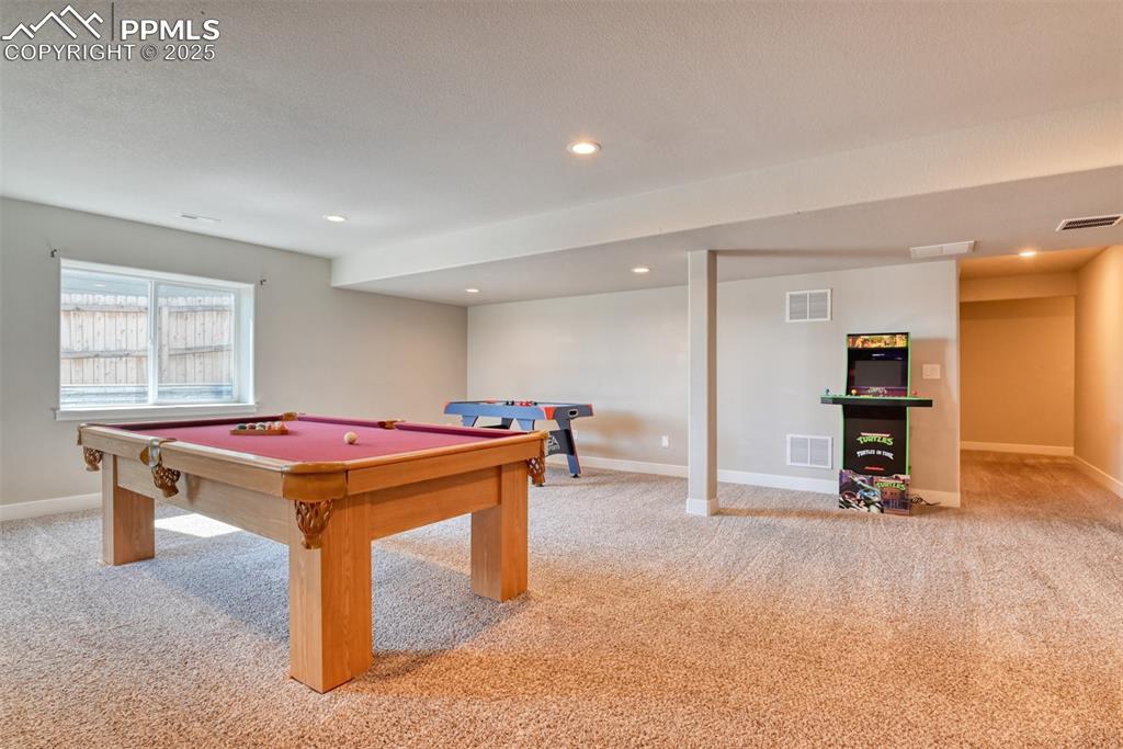 Image 29 of 45: Game room with light carpet, billiards, and recessed lighting