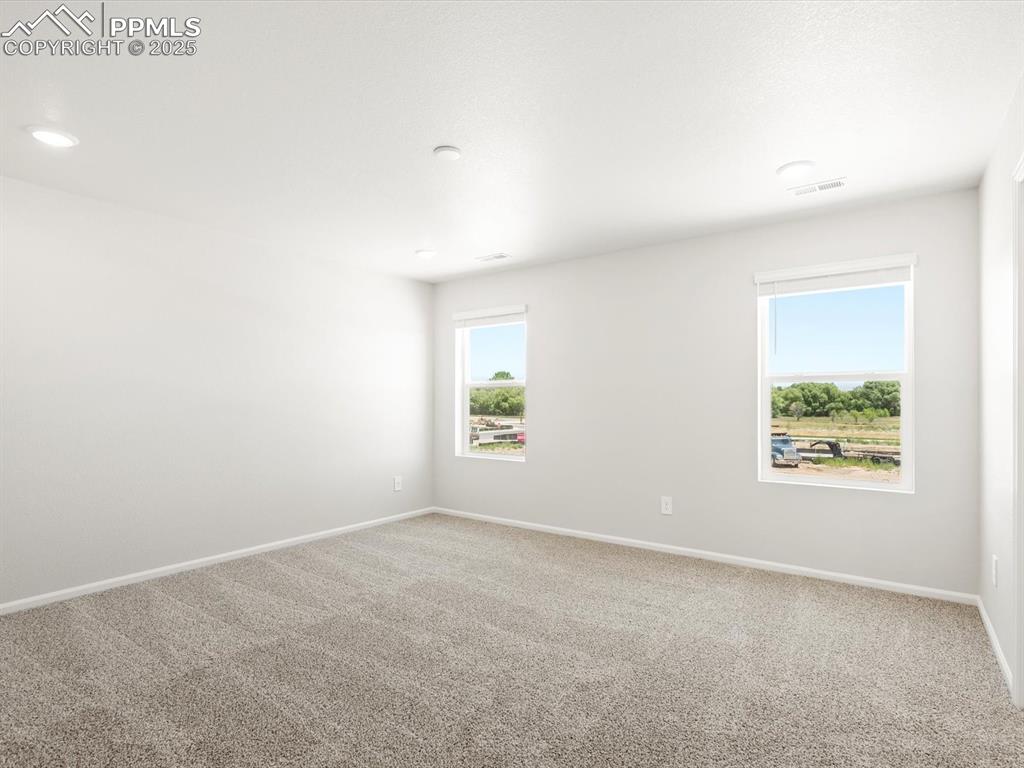 Image 24 of 44: Empty room with baseboards and carpet floors