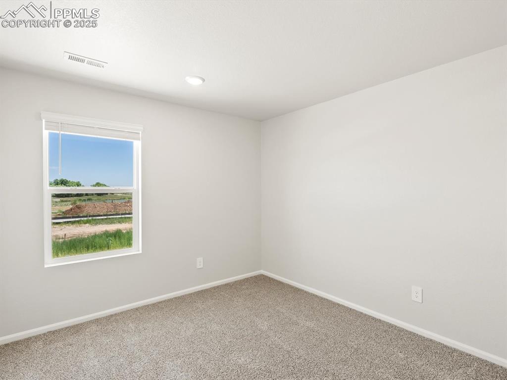 Image 28 of 44: Spare room with carpet floors and recessed lighting