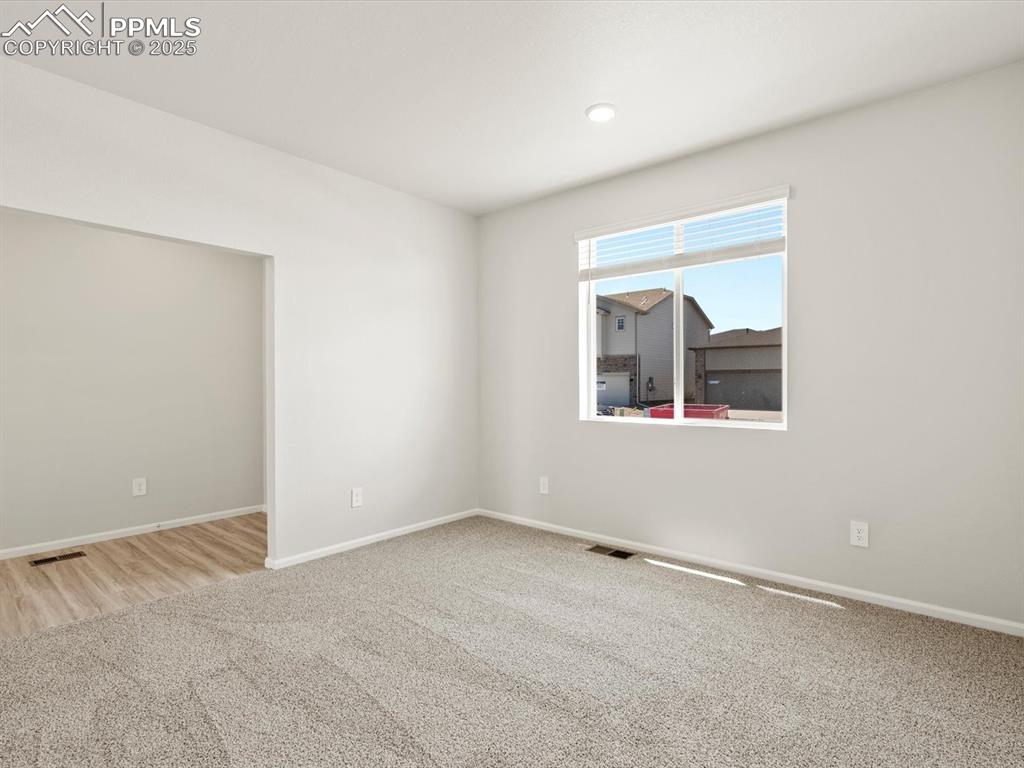 Image 32 of 44: Carpeted spare room featuring baseboards and recessed lighting