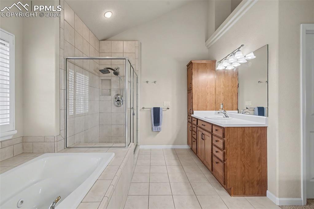 Image 18 of 48: Separate Vanities and Dual Walk-in Closets!