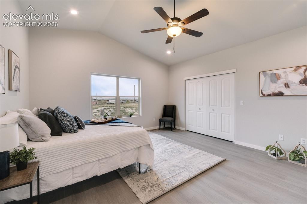 Image 16 of 28: Vaulted ceiling, recessed lighting, ceiling fan with integrated light, wind