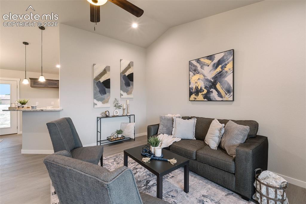 Image 7 of 28: Vaulted ceiling, recessed lighting, wood-finish flooring, ceiling fan, and 