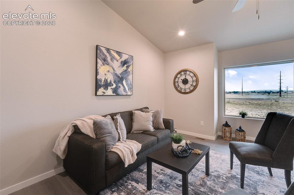 Image 8 of 28: Vaulted ceiling, recessed lighting, wood-finish flooring, ceiling fan, and
