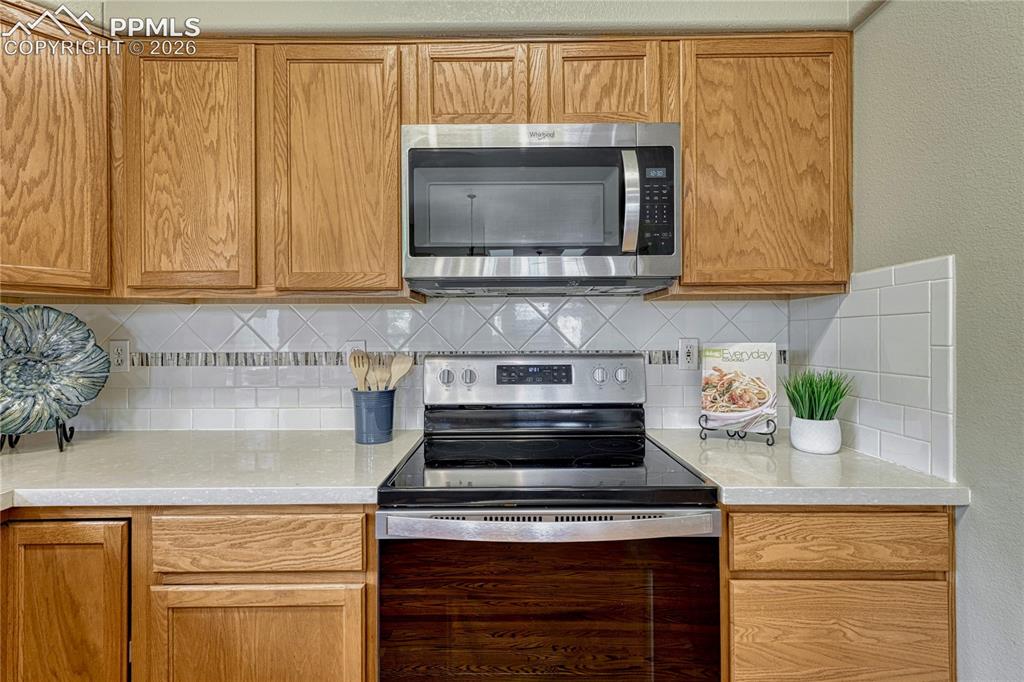 Image 12 of 48: The well-appointed kitchen boasts a convenient double sink with an elegant 