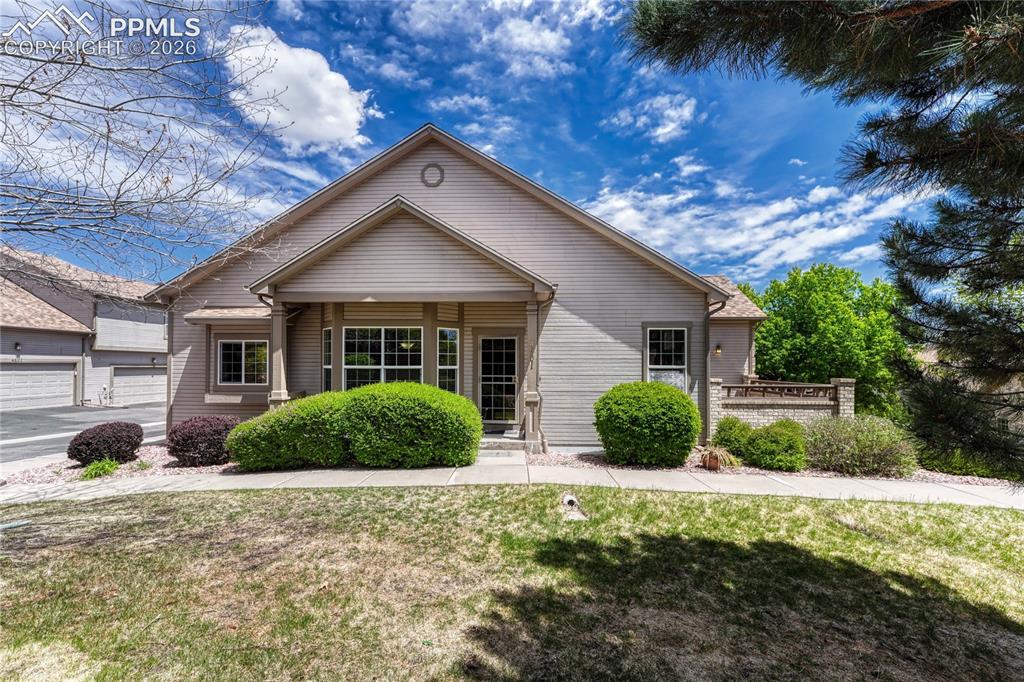 Image 2 of 48: Welcome to an end-unit ranch style townhome featuring beautiful exterior br