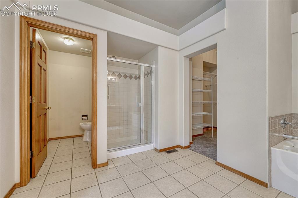Image 25 of 48: Unwind after a long day in the luxurious deep soaking tub, or utilize the s