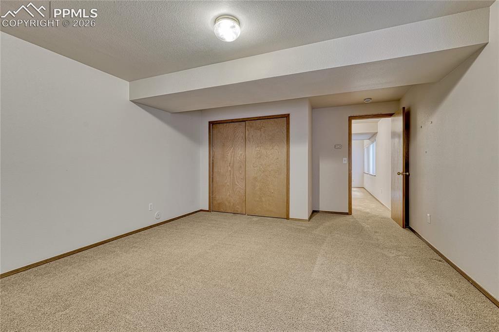 Image 30 of 48: The fully finished basement features a massive family room perfect for easy