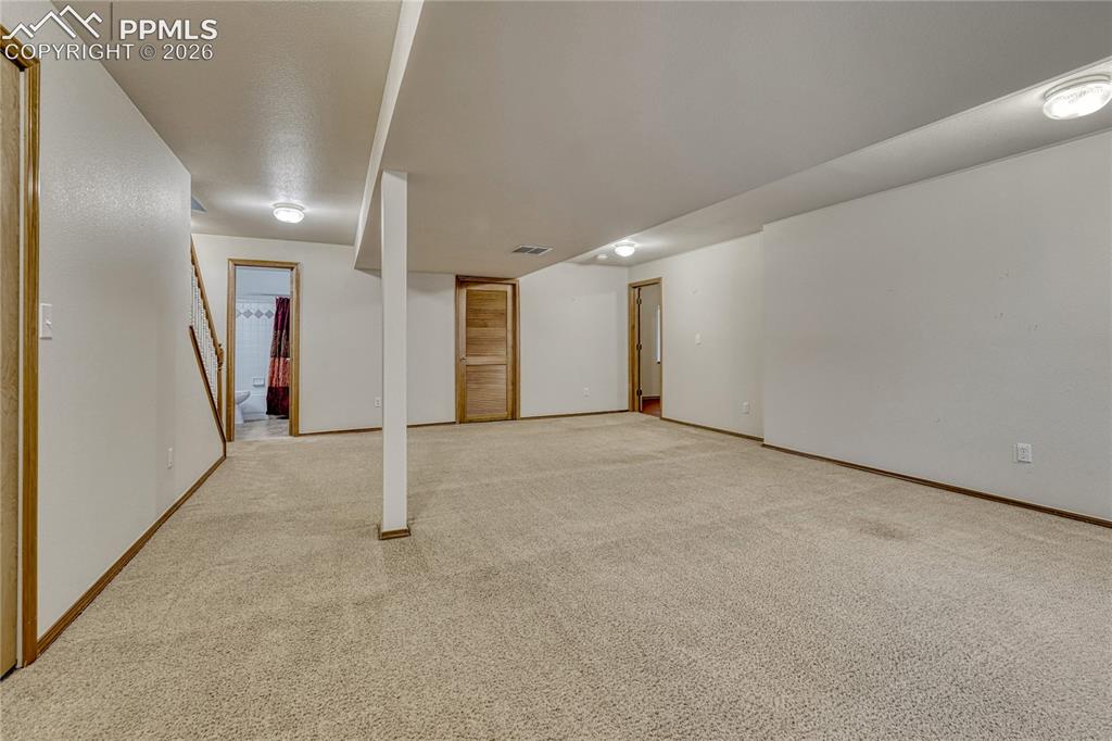 Image 32 of 48: Guests will be comfortable in the over-sized basement bedroom with enough r