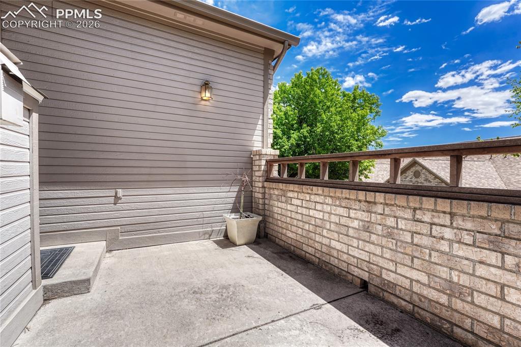 Image 38 of 48: Step outside to your private concrete patio, perfect for enjoying Colorado