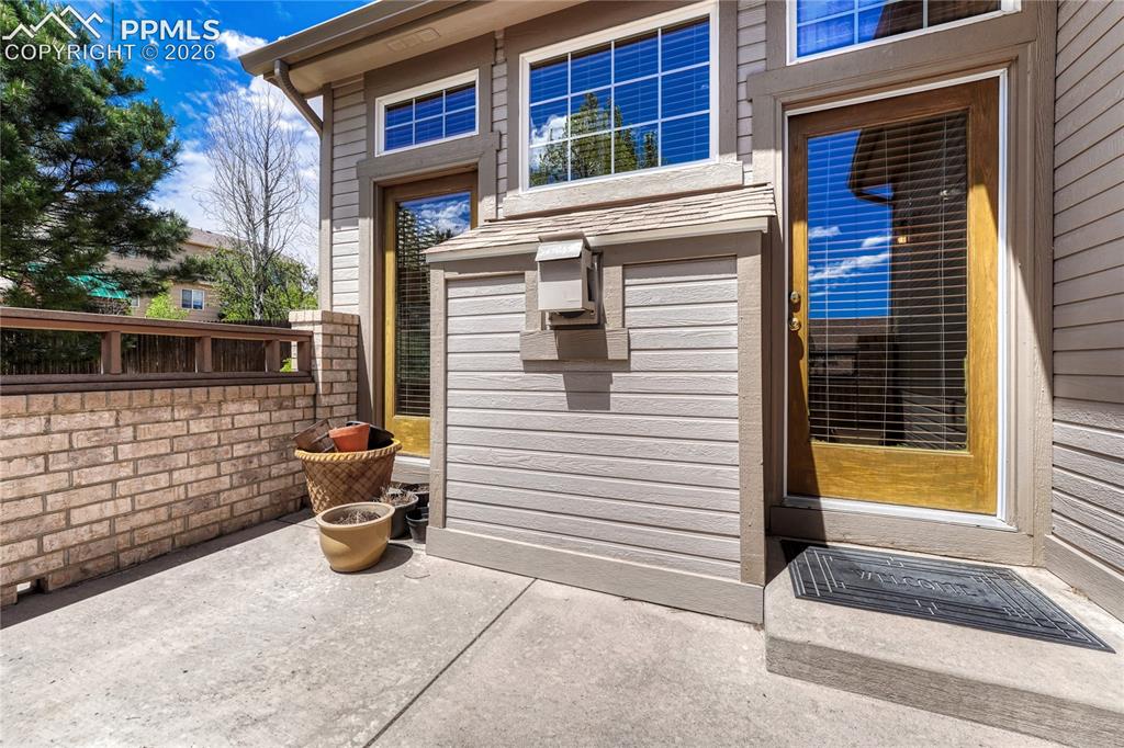 Image 39 of 48: This low-maintenance patio space provides the perfect spot for a quiet even