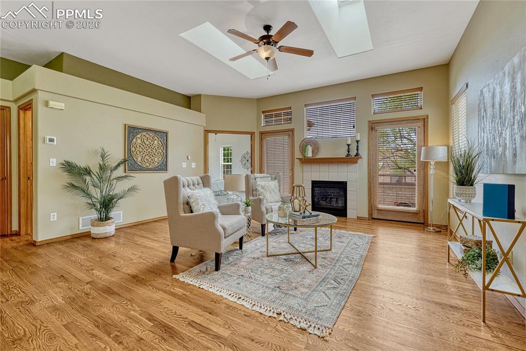Image 4 of 48: Step into a bright and airy living room full of natural light from two skyl