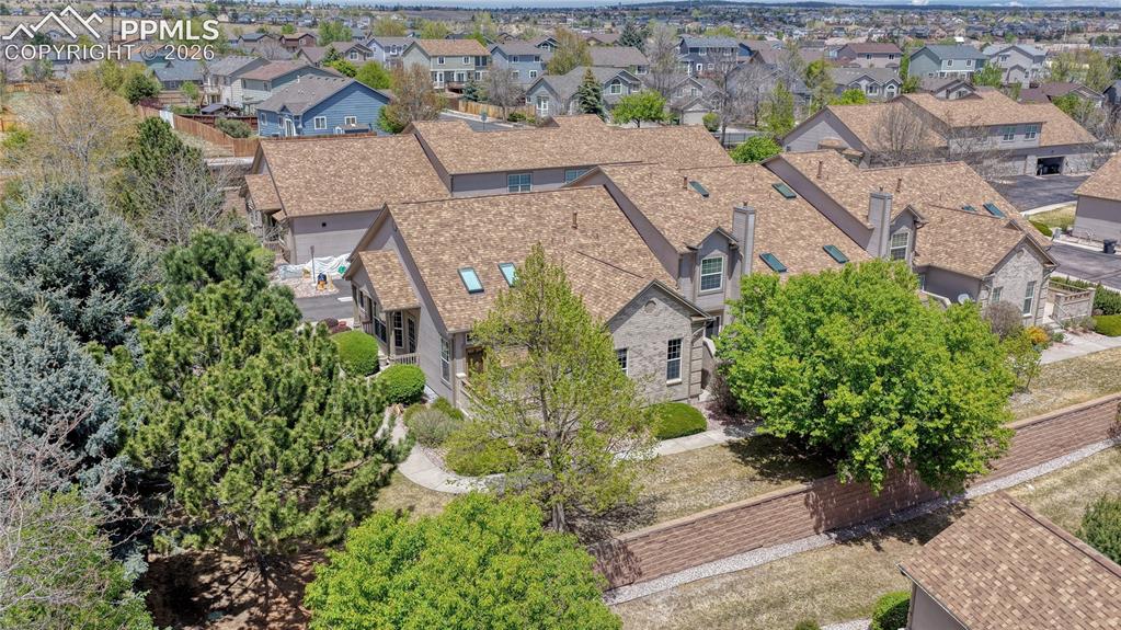 Image 46 of 48: Nestled among mature trees, this home offers a sense of established charm w