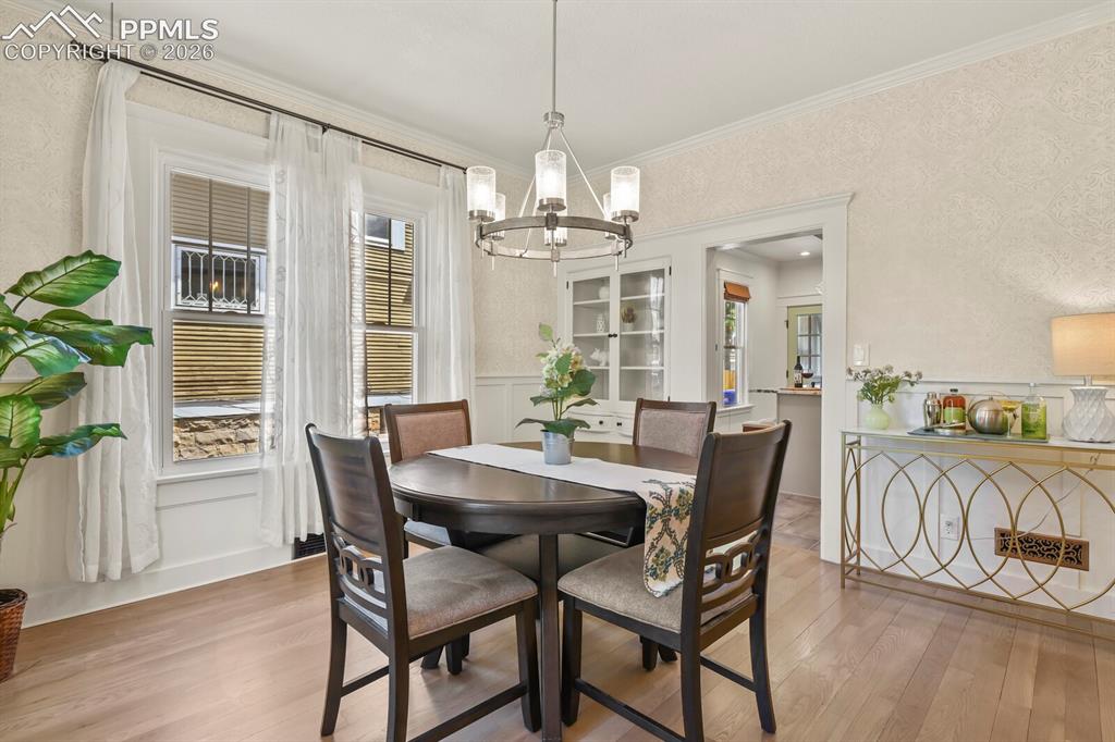 Image 13 of 40: Large dining room with original built-in hutch 
