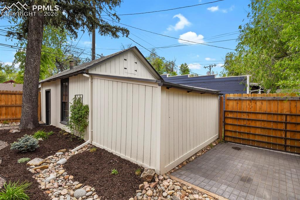 Image 39 of 40: garage with an extra extended area for additonal storage. Also, a paved spa