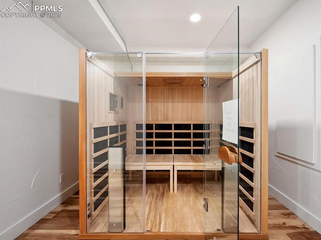 Image 11 of 31: Relaxing sauna with wood finished floors and baseboards
