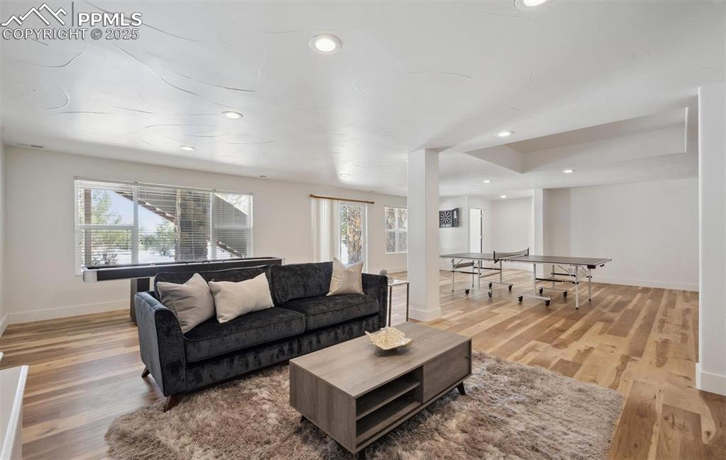 Image 14 of 31: Living room featuring recessed lighting and light wood-style floors