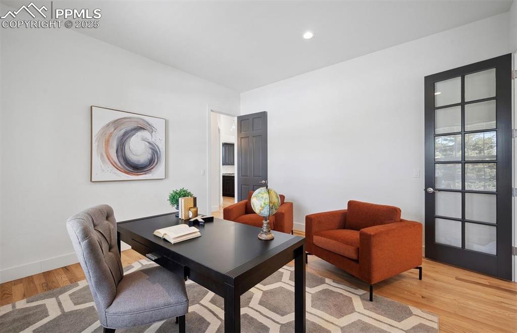 Image 15 of 31: Office featuring light wood-style floors and recessed lighting