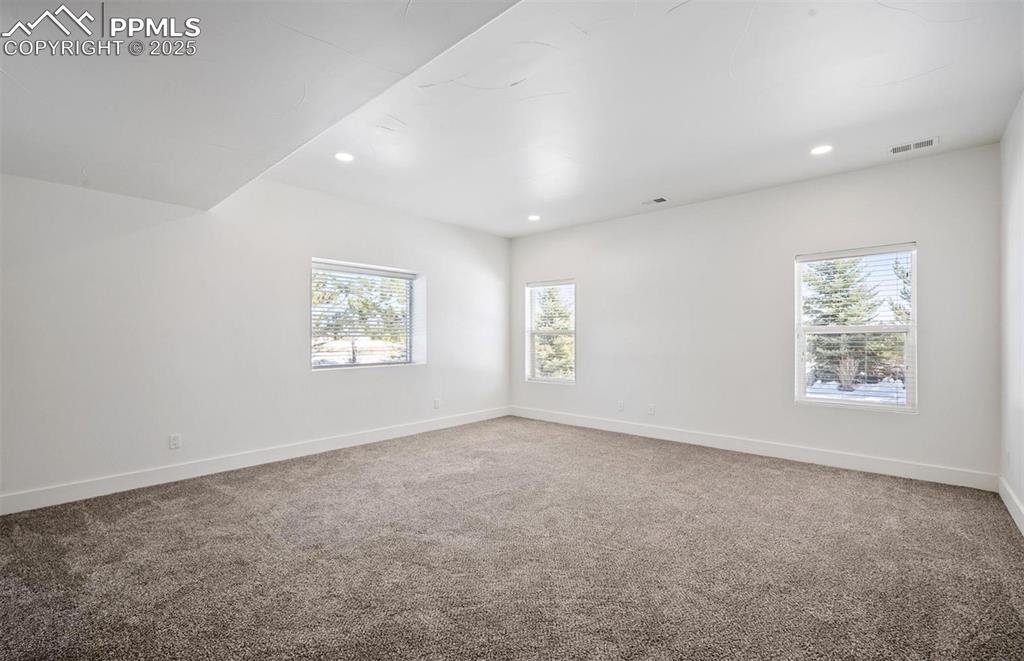 Image 17 of 31: Empty room featuring light carpet and recessed lighting