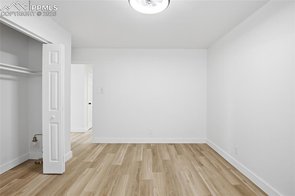Image 27 of 44: Room featuring light wood-style flooring, white walls, and a ceiling light 