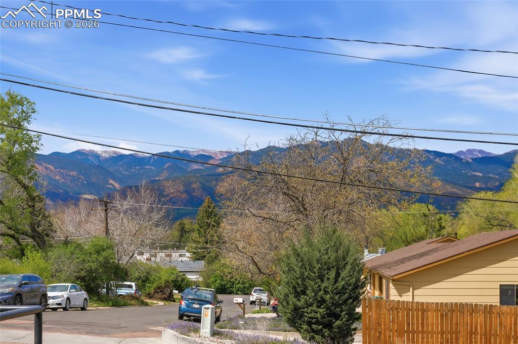 Image 43 of 44: Enjoy mountain views from the property, featuring a private fenced yard and
