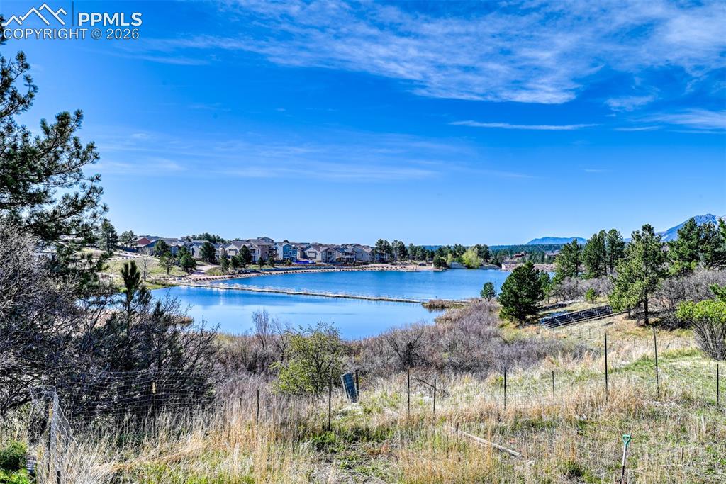 Image 2 of 38: View of the lake from the Rasberry Townhome open space