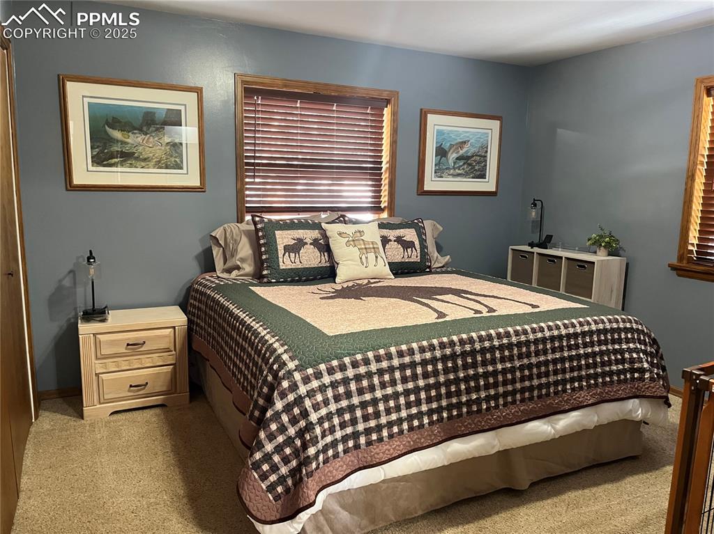 Image 13 of 28: Great size for king size furniture on the main level in this primary bedroo