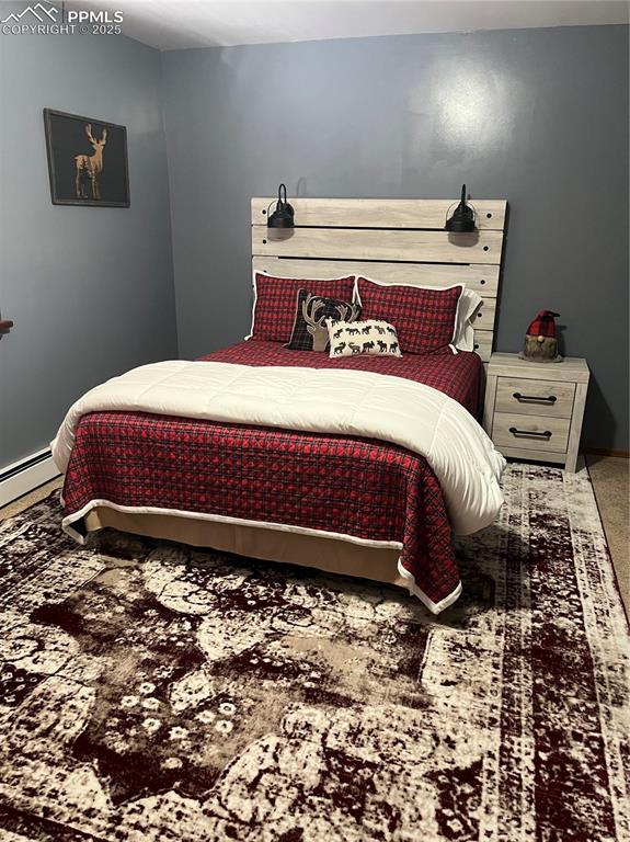 Image 16 of 28: Large upper level bedroom.